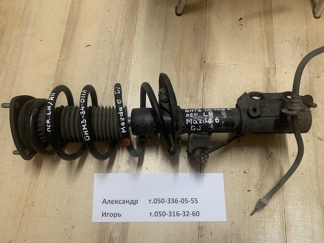 Стійка передня, ліва GHT634900A MAZDA