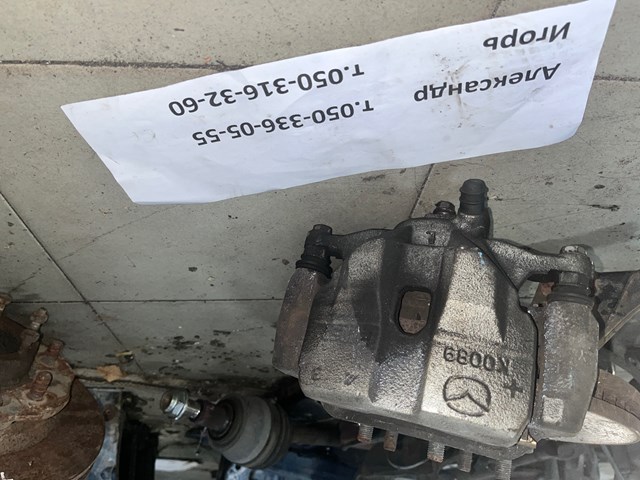 Супорт гальмівний, передній, лівий GHY93399Z MAZDA