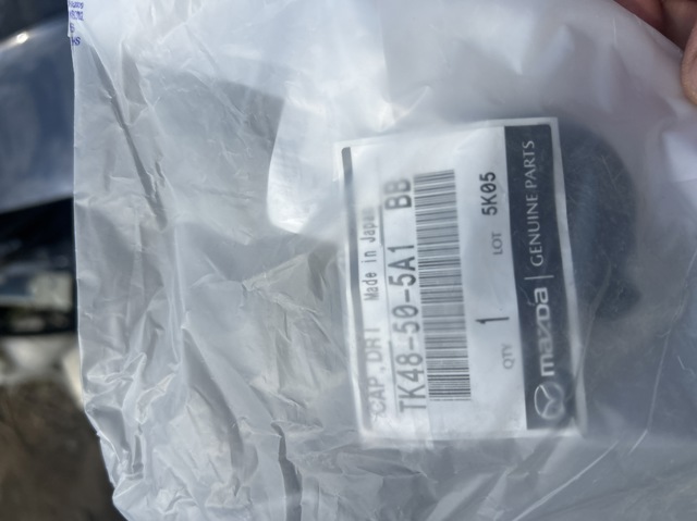 Заглушка бампера буксирувального гака, задня TK48505A1BB MAZDA