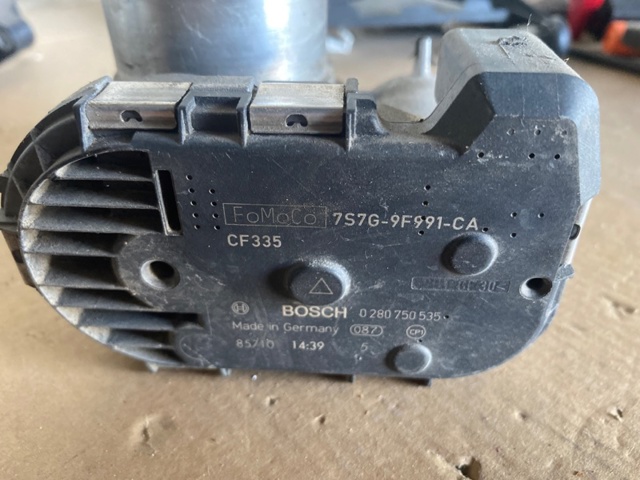 Дросільна заслінка в зборі 7S7G9F991CA FORD