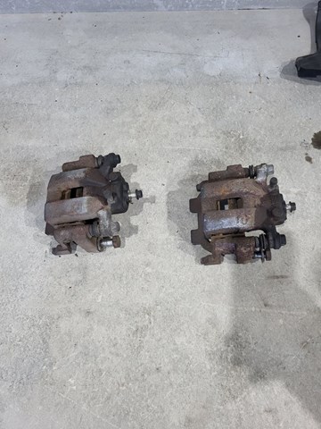 Супорт гальмівний задній правий 440011AA0A NISSAN