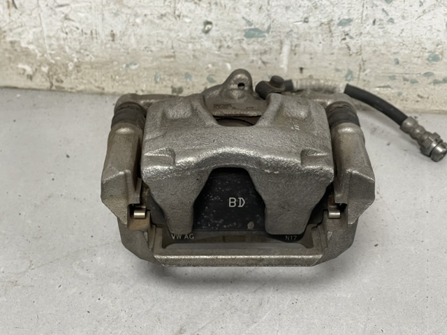 Задній гальмівний супорт лівий 8W0615403 VAG