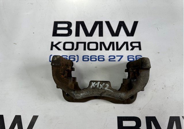 Скоба супорта переднього 34116867311 BMW