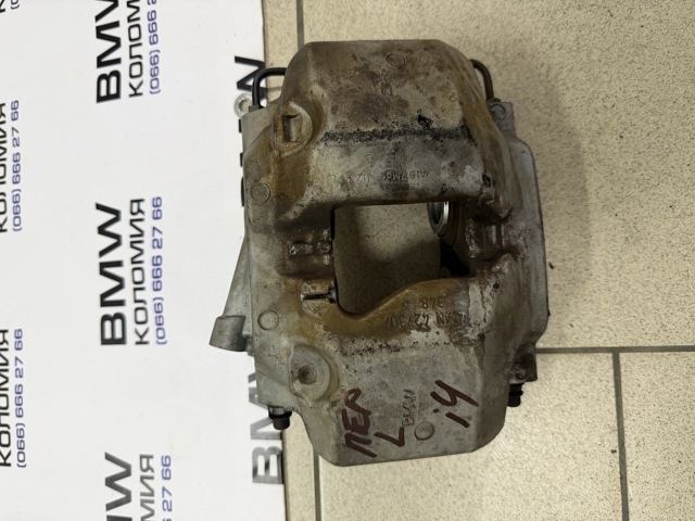 Супорт гальмівний, передній, лівий 34116883483 BMW