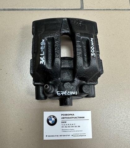 Задній гальмівний супорт лівий 34216769101 BMW