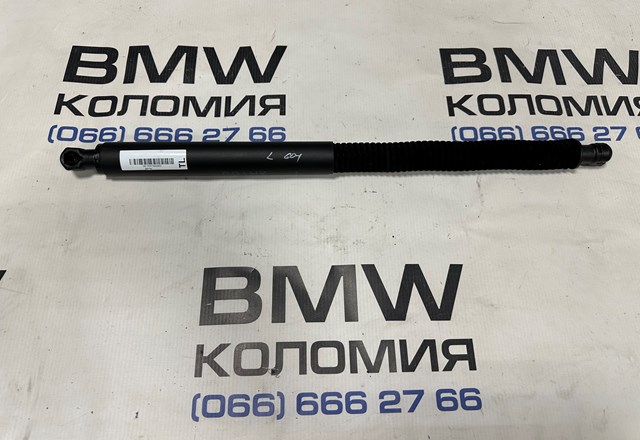Амортизатор багажника лівий 51247497482 BMW