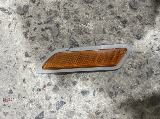 Катафот (відбивач) переднього бампера, лівий 7274521 BMW