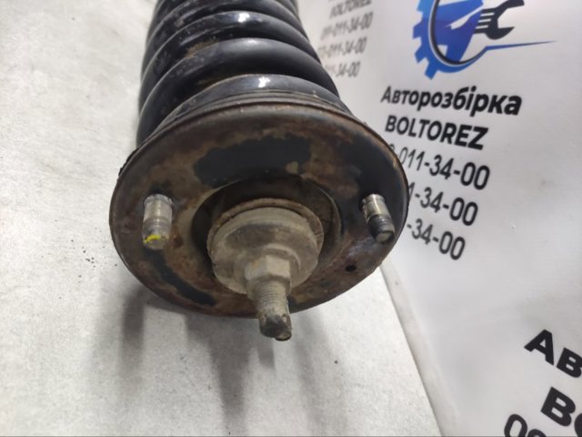 Амортизатор передньої підвіски 561005X07A NISSAN