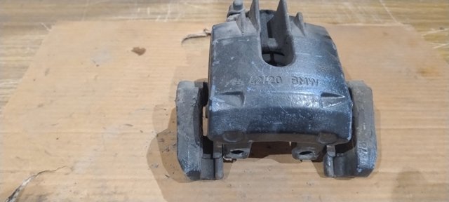 Задній гальмівний супорт лівий 34216765909 BMW