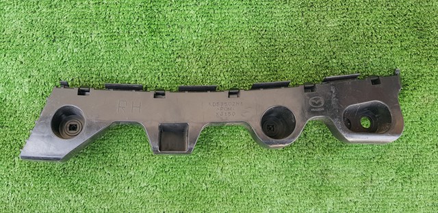 Кронштейн бампера заднього, зовнішній правий KD53502H1 MAZDA
