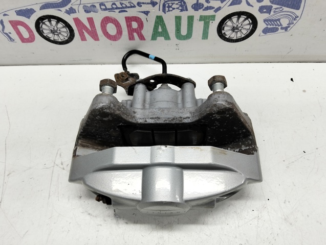 Задній гальмівний супорт лівий 44011JL02A NISSAN
