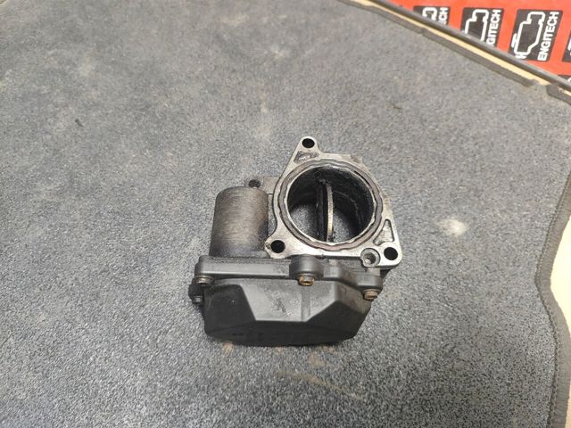 Дросільна заслінка в зборі 03G128063Q VAG