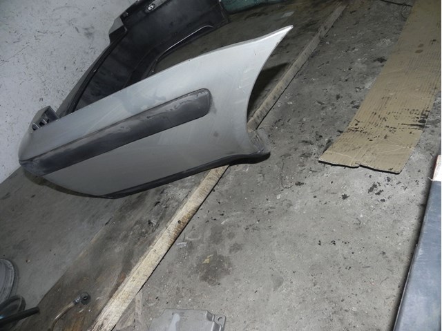 Кожух бампера заднього 1U6807421A VAG