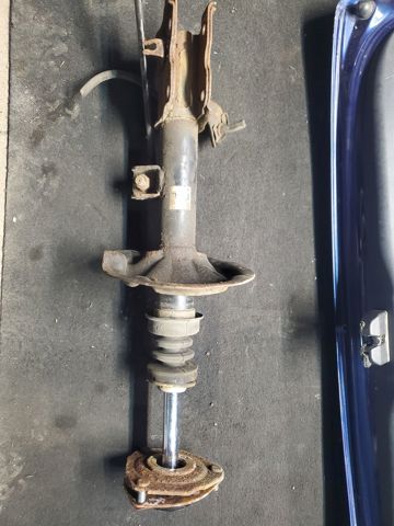 Амортизатор передньої підвіски, лівий 54303CB025 NISSAN