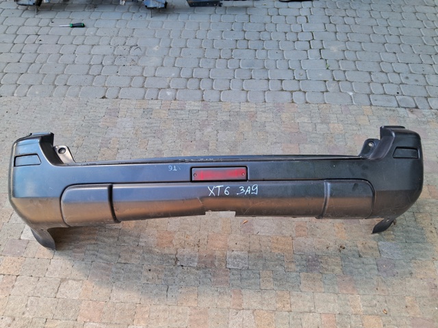 Бампер задній 850228H326 NISSAN