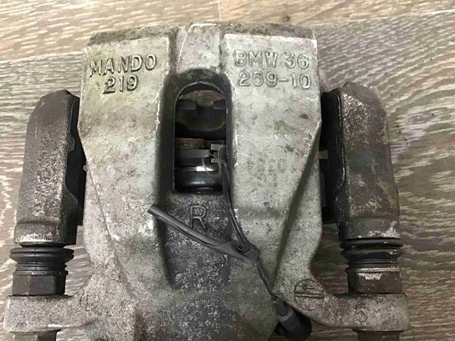 Супорт гальмівний задній правий 34216860558 BMW