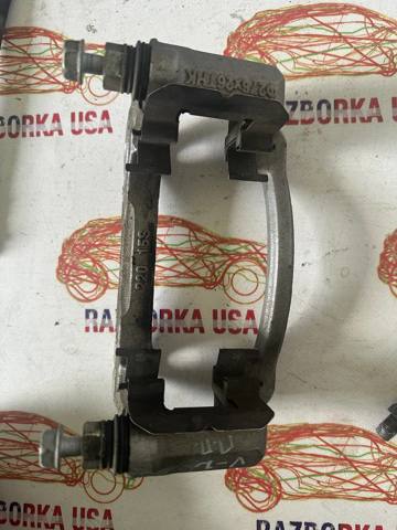 Скоба гальмівного супорта переднього 13588983 GM