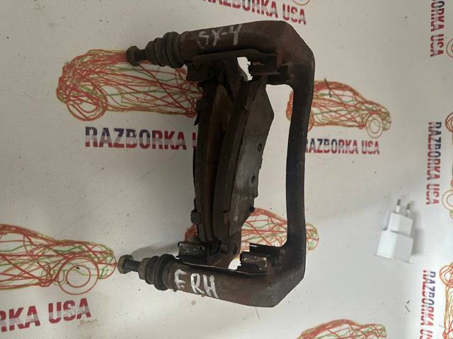 Скоба супорта переднього 5586079J00 SUZUKI