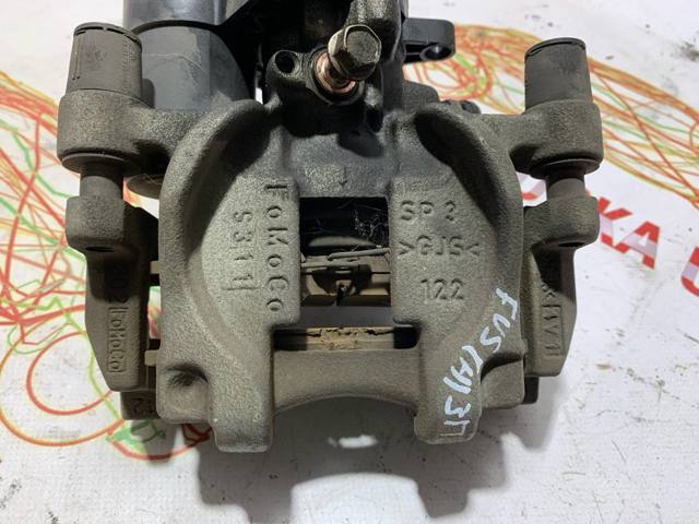 Супорт гальмівний задній правий DG9Z2552C FORD