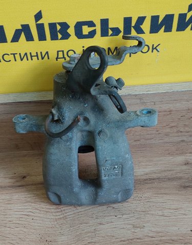 Задній гальмівний супорт лівий 1K0615423C VAG