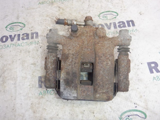 Задній гальмівний супорт лівий 440114EA0A NISSAN