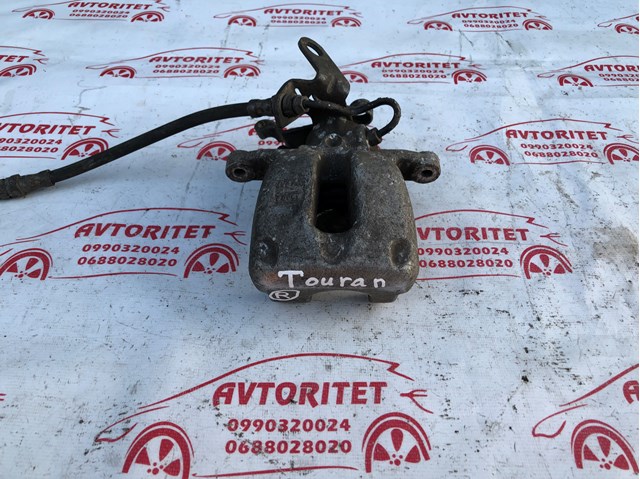 Супорт гальмівний задній правий 1K0615424M VAG