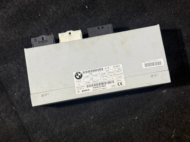 Блок управління відкриття кришки багажника 61357412610 BMW