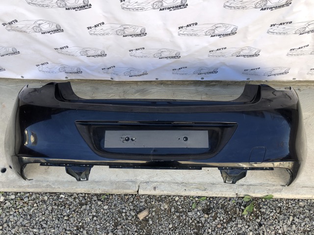 Бампер задній 20877796 OPEL