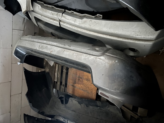 Кожух бампера заднього 57704AG11A SUBARU