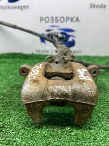 Задній гальмівний супорт лівий 1K0615423J VAG