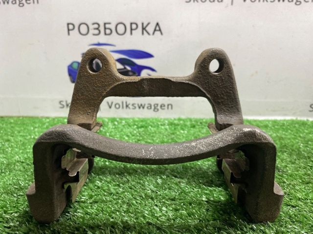 Скоба гальмівного заднього супорта 1K0615425M VAG