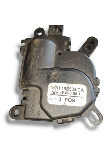 Мотор заслінки печі 1S7H19B634CA FORD