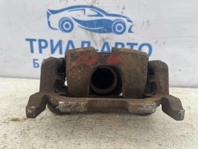 Задній гальмівний супорт лівий 440111AA0A NISSAN