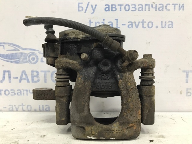 Задній гальмівний супорт лівий 440114CA0A NISSAN