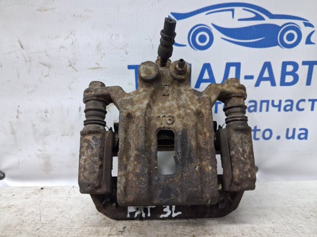 Задній гальмівний супорт лівий 44011EB30A NISSAN