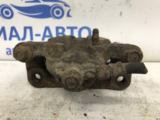 Задній гальмівний супорт лівий 44011JG00A NISSAN