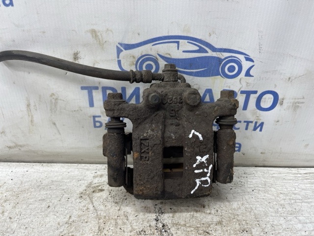 Задній гальмівний супорт лівий 44011JG00A NISSAN