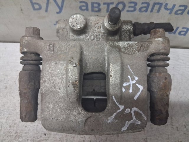 Задній гальмівний супорт лівий 4605A477 MITSUBISHI