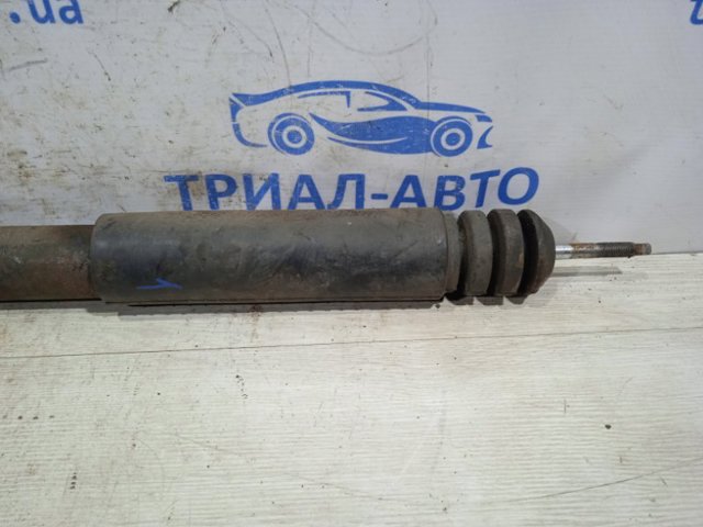 Амортизатор задньої підвіски E62101KA1B NISSAN
