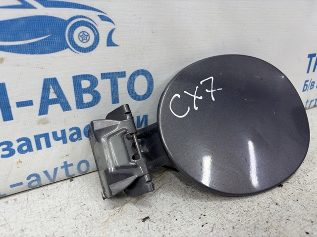 Дверцята бензобака EH4442410 MAZDA