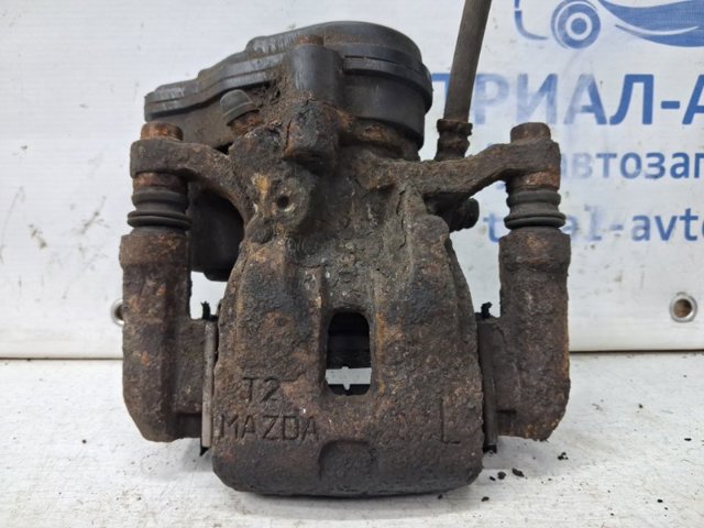 Скоба супорту заднього KAY02629X MAZDA