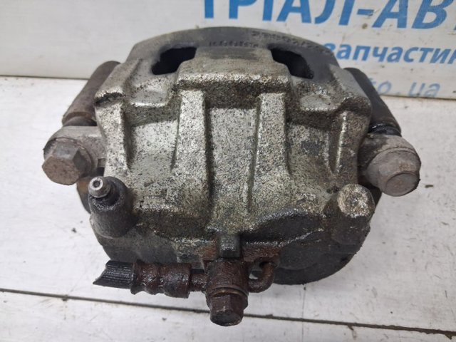 Супорт гальмівний, передній, лівий L20633990A MAZDA