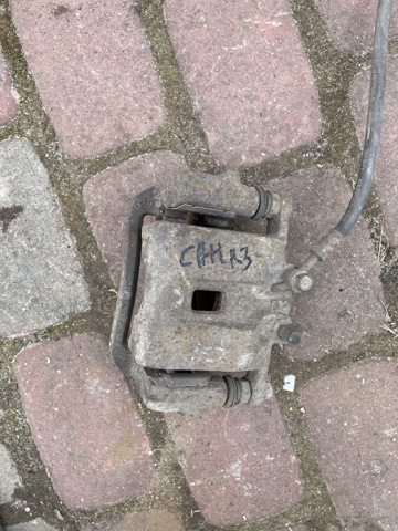Задній гальмівний супорт лівий 582104Z700 HYUNDAI