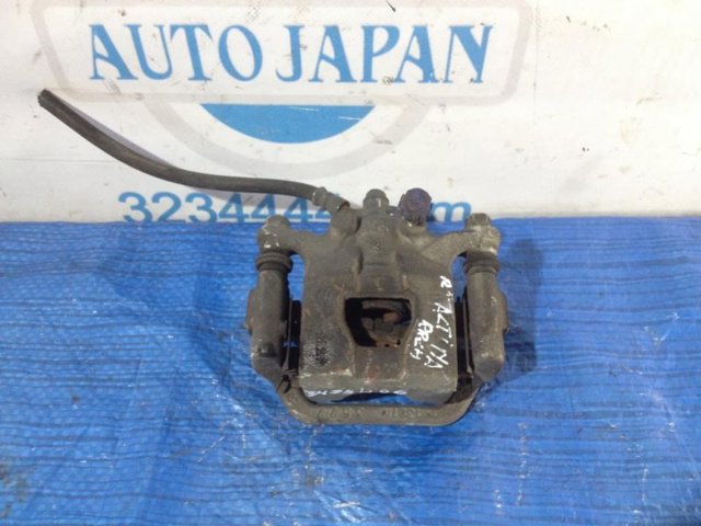 Задній гальмівний супорт лівий 44011JA01A NISSAN