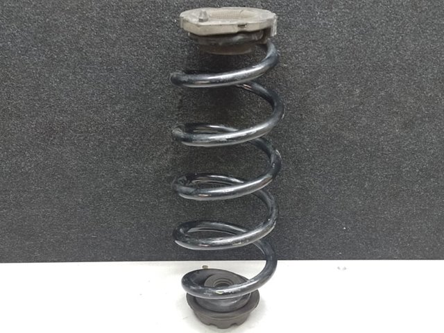 Проставка (гумове кільце) пружини задньої, верхня 55034EN101 NISSAN