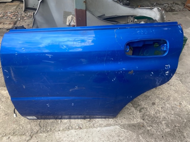 Двері пасажирськи задні ліві 60409FE052 SUBARU