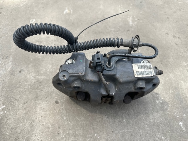 Задній гальмівний супорт лівий 7P0615423 VAG