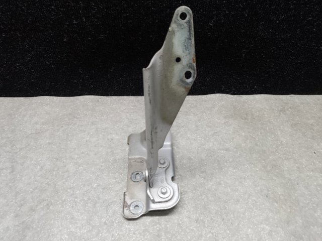 Петля капота, ліва 7T4Z16797A FORD