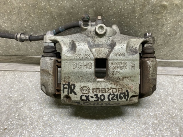 Супорт гальмівний, передній, правий DGY93398Z MAZDA