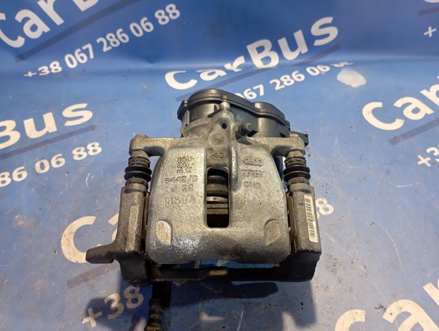 Задній гальмівний супорт лівий 8K0615403E VAG